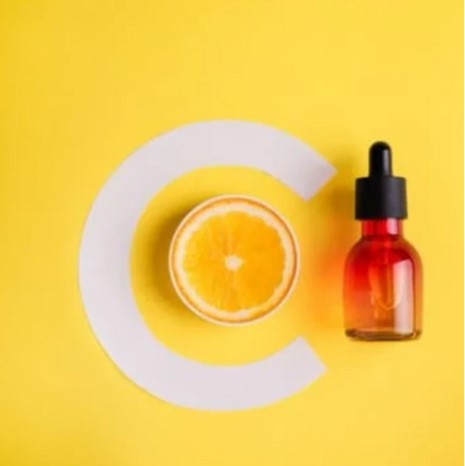 Glass-empty-jar-for-serum-on-a-yellow-background
